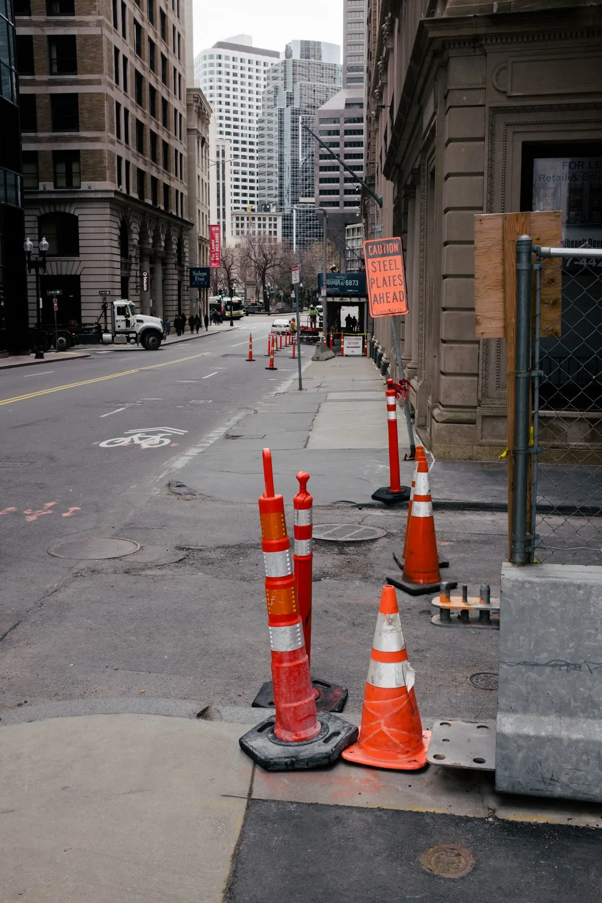 Cones and posts along a city street corner